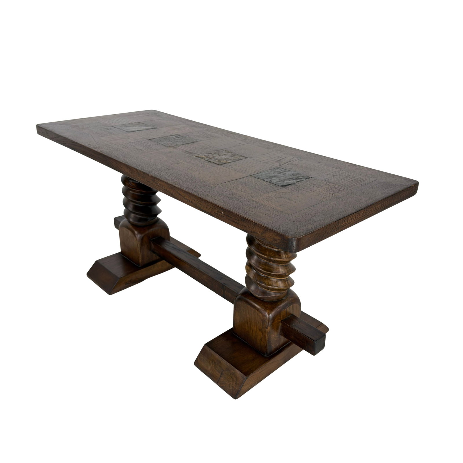 COFFEE TABLE MANNER OF CHARLES DUDOUYT, 1940s: Dimensions: H 19.5” x W 41 ” x D 17.5”. Brutalist French coffee table manner of Charles Dudouyt with bobbin-style pedestal legs with stretcher.