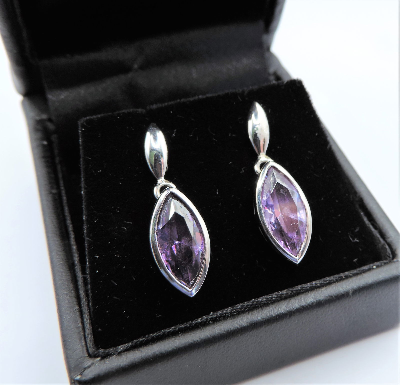 Sterling Silver Amethyst Drop Earrings. A lovely pair of sterling silver drop earrings each set with (1 of 3)