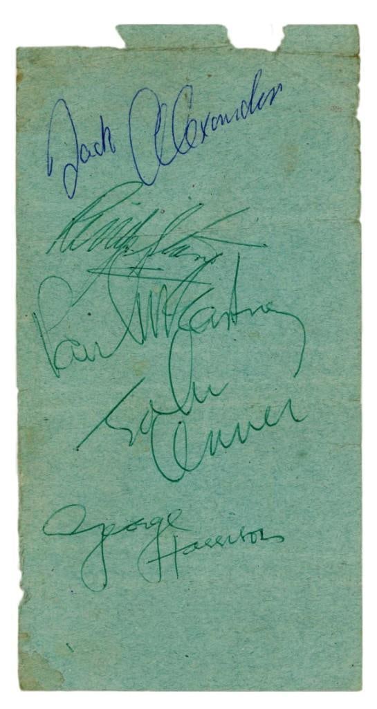 The Beatles Group Signed 1964 Autograph Page (Edinburgh Scotland) (4 Sigs) (Tracks COA): Green piece of paper, 3.75" x 7.1," that has been signed by all four members of The Beatles in green ballpoint pen: John Lennon, Paul McCartney, George Harrison, and Ringo Starr; the paper has al