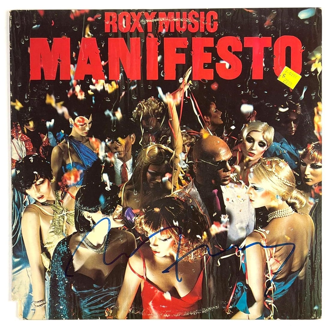 Roxy Music: Bryan Ferry Signed "Manifesto" Album (Beckett/BAS Authentication): "Manifesto" album signed on the cover in blue felt tip marker by Bryan Ferry. In very good condition, with some scattered wear and a price clip to lower left edge. Record is included. Accompanied by a
