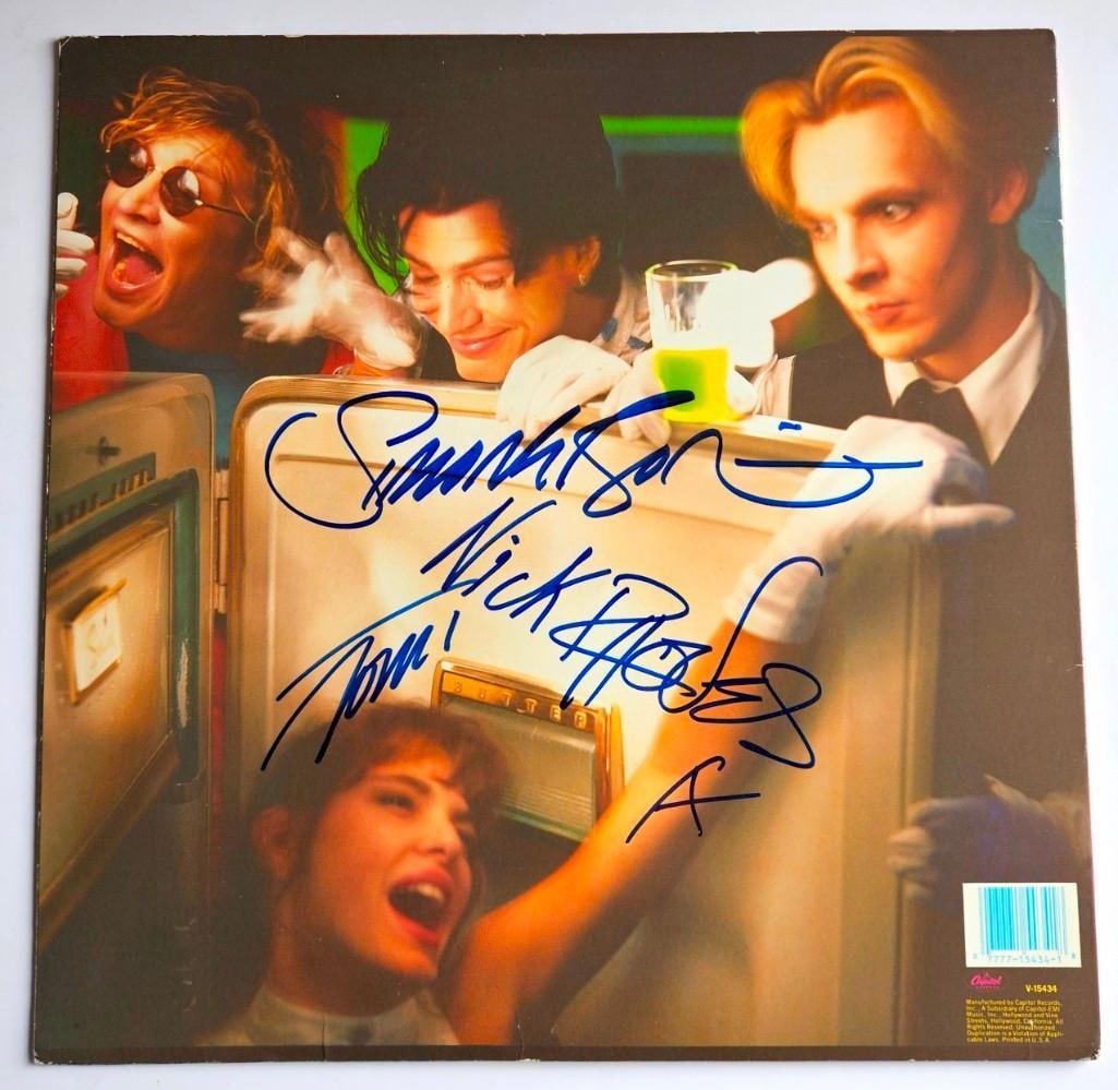 Duran Duran Group Signed "All She Wants Is More" 12" Record (3 Sigs) (Third Party Guaranteed): “All She Wants Is More” 12" single record signed on the back cover in blue felt tip by three members of Duran Duran: Simon LeBon, Nick Rhodes and John Taylor. In very good condition, with