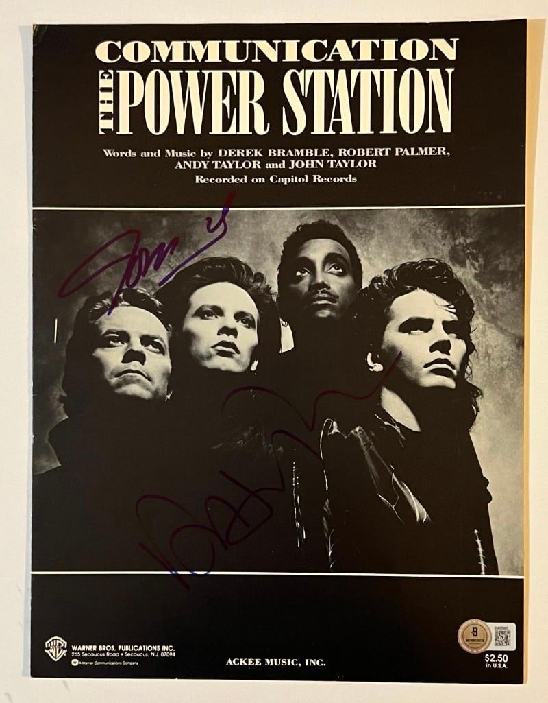 [Duran Duran] Power Station: John & Andy Taylor In-Person Signed Sheet Music (Beckett/BAS): Original Power Station "Communication" sheet music, 9" x 12," signed in blue felt tip marker by John Taylor and Andy Taylor. In fine condition. Beckett/BAS Authentication hologram present at bott