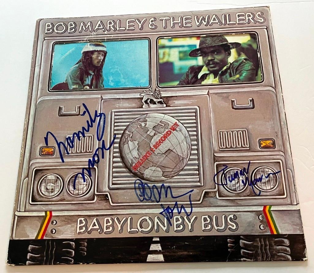 Bob Marley & The Wailers: Family Man, Ect Signed "Babylon by Bus" Album (Third Party Guaranteed): "Babylon by Bus" album by Bob Marley & The Wailers signed on the front cover by three key members of the band: Family Man Barrett, Al Anderson, and Junior Marvin. In fine condition. Provenance Eat