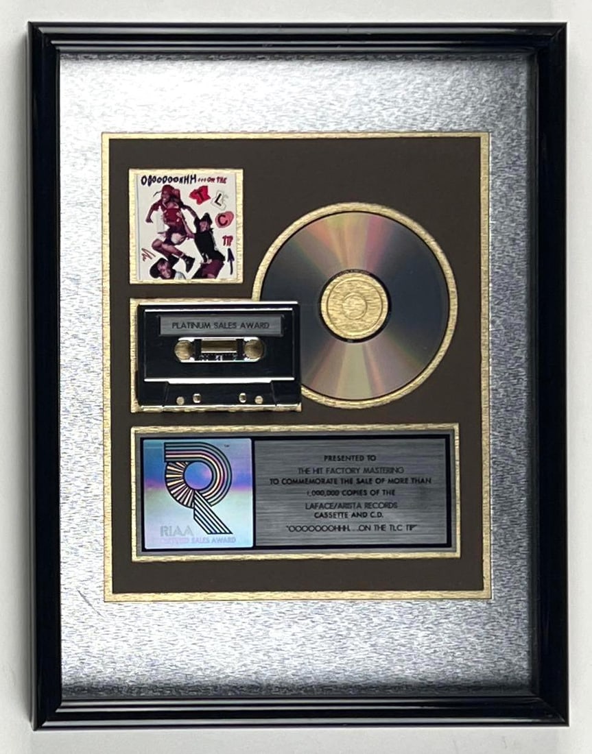 TLC "Ooohhh..." RIAA Platinum Album Sales Award Presented to The Hit Factory Mastering: RIAA Certified Platinum Sales Award presented to The Hit Factory Mastering to commemorate the sale of more than 1,000,000 copies of the LaFace/Arista Records cassette and CD "Ooohhh... On the TLC
