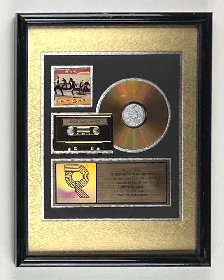 The Kinks "State of Confusion" RIAA Gold Album Sales Award Presented to The Hit Factory: RIAA Certified Gold Sales Award presented to The Hit Factory to commemorate the sale of more than 500,000 copies of the Arista Records album, cassette, and CD "State of Confusion" by The Kinks. This a