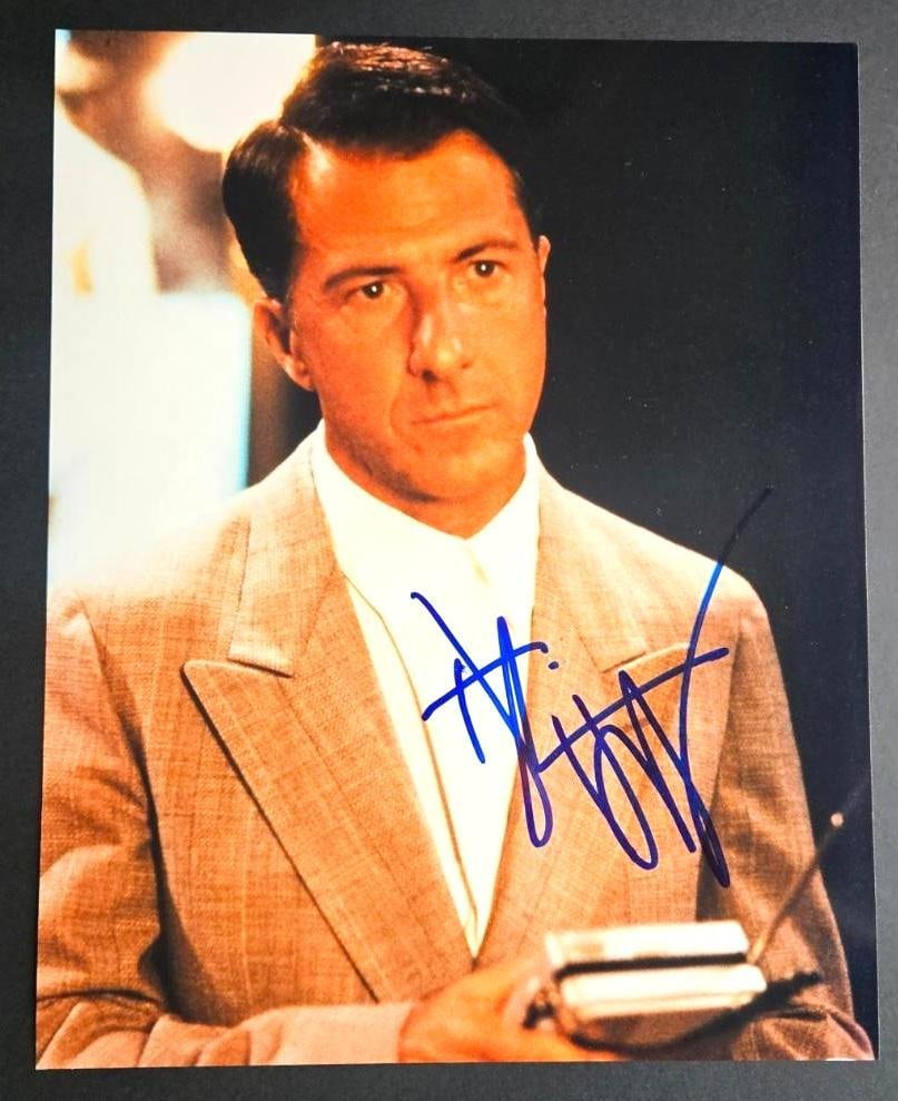 Dustin Hoffman In-Person Signed Photo (Third Party Guaranteed): Color 8" x 10" photo signed in blue felt tip marker by Dustin Hoffman. In fine condition. Obtained in-person. Provenance Eaton & Brennan Auctions guarantees this lot to pass Third-Party Authentic