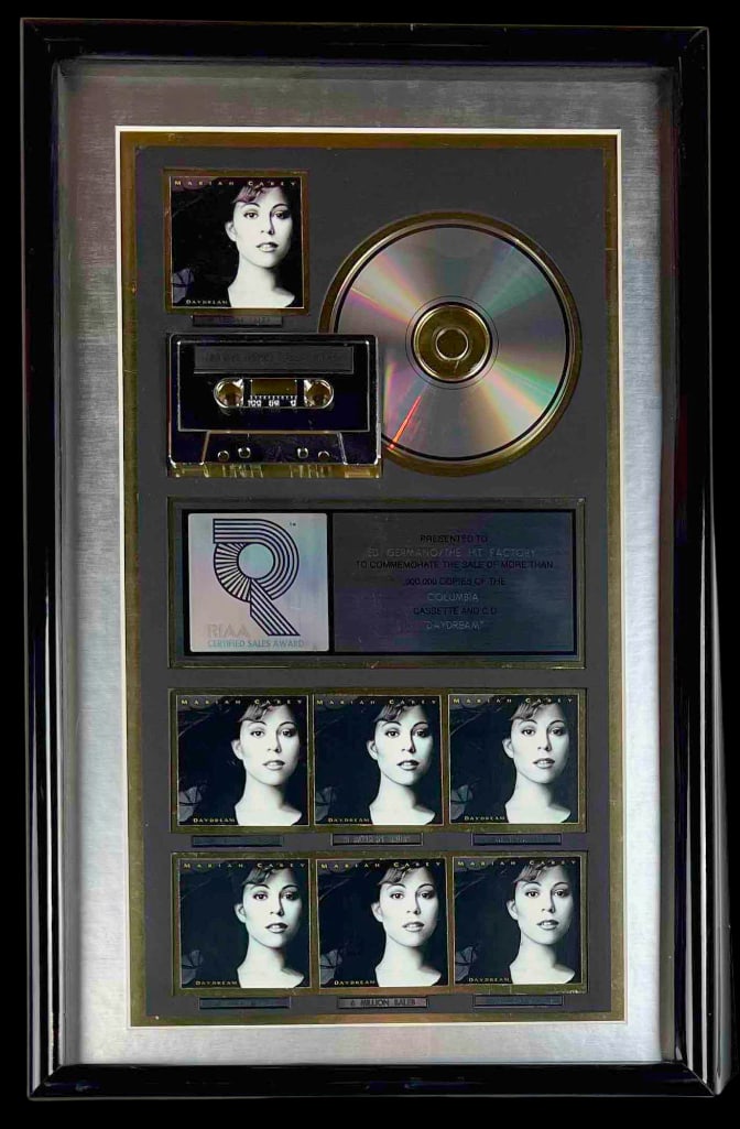 Mariah Carey "Daydream" RIAA Multi-Platinum Sales Award Presented to The Hit Factory: RIAA Certified Multi-Platinum Sales Award presented to Ed Germano/The Hit Factory to commemorate the sale of more than 7,000,000 copies of the Columbia cassette and CD "Daydream." The framed display, 