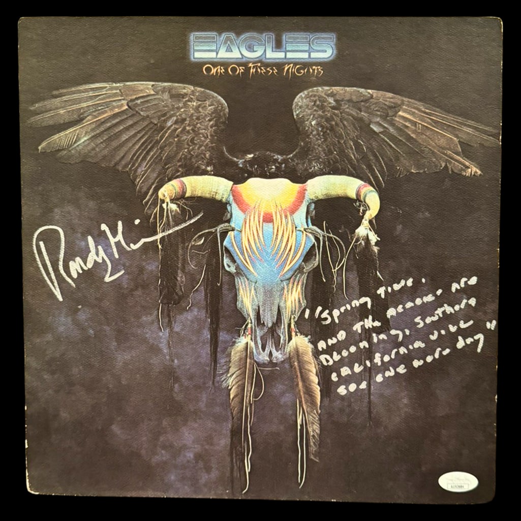 Eagles: Randy Meisner Signed "One of These Nights" Album w/ Handwritten Lyrics (JSA Authentication): "One of These Nights" album signed in silver paint pen by Eagles founding member Randy Meisner, who also added a handwritten lyric excerpt from "Hollywood Waltz." In fine condition, with some light we