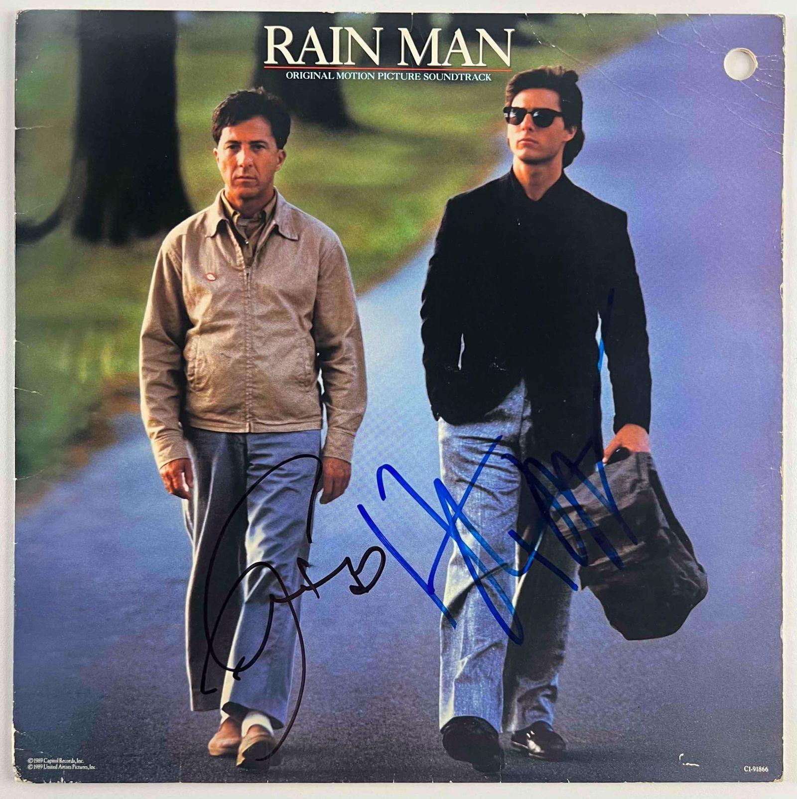 Rain Man: Tom Cruise & Dustin Hoffman Signed Soundtrack (Oscar Winner Best Picture & Actor) (BAS): “Rain Man” original motion picture soundtrack album cover, signed by stars Dustin Hoffman in black felt tip marker and Tom Cruise in blue felt tip marker. A striking pairing of autographs