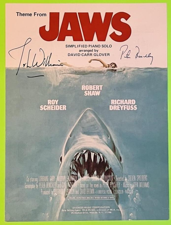 John Williams & Peter Benchley Signed 12" x 9" "Jaws" Theme Sheet Music (Third Party Guaranteed): "Theme from Jaws" original piano sheet music cover signed in black felt tip marker by John Williams and in black ink by Peter Benchley. Measures approximately 12" x 9". In fine condition. Comes with K