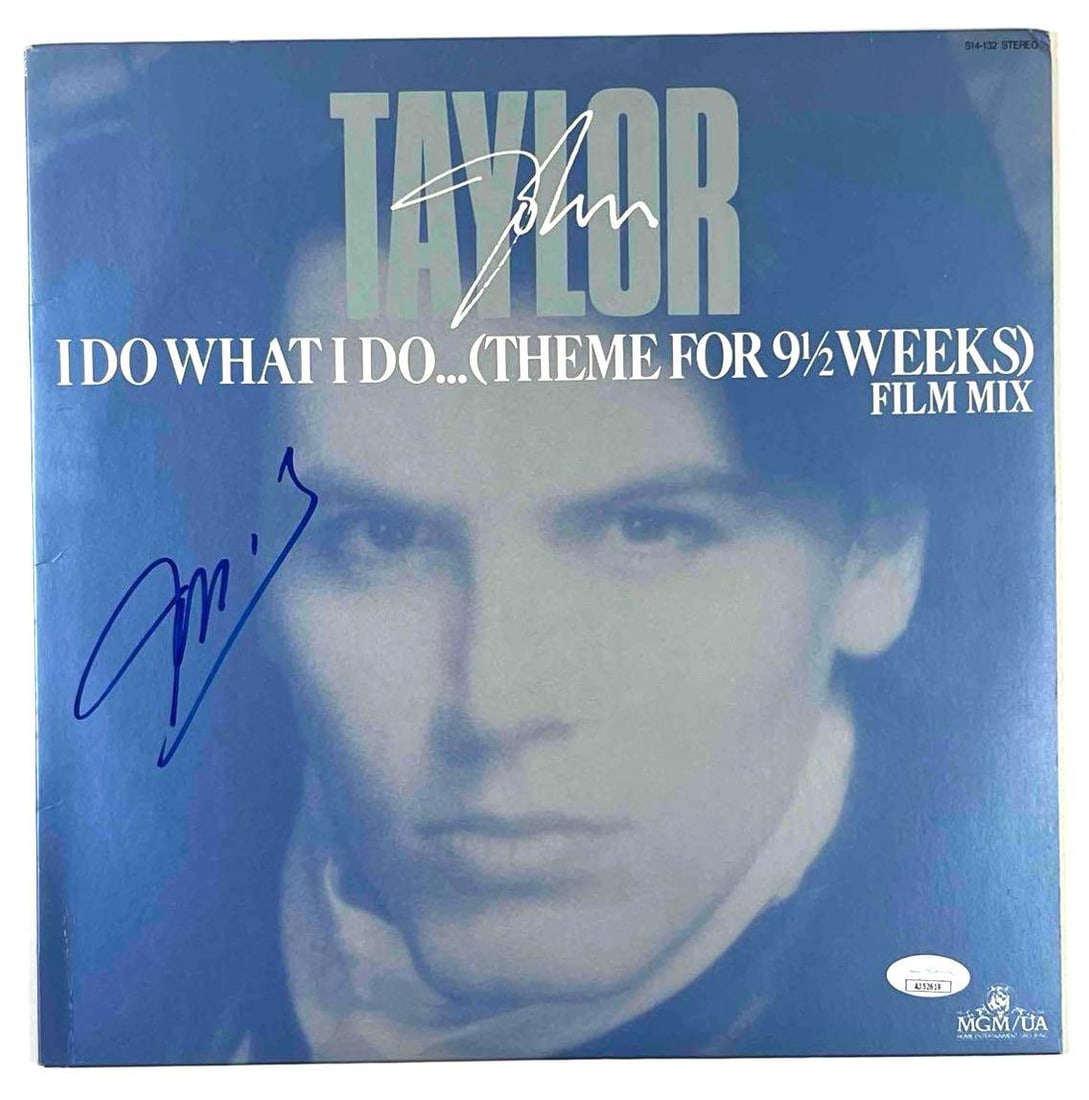 Duran Duran: John Taylor In-Person Signed "I Do What I Do" 12" Record (JSA Authentication): "I Do What I Do... (Theme for 9½ Weeks)" 12" record album signed on the cover in blue felt tip marker by Duran Duran bassist John Taylor. Measuring approximately 12" x 12" and in fine condition.