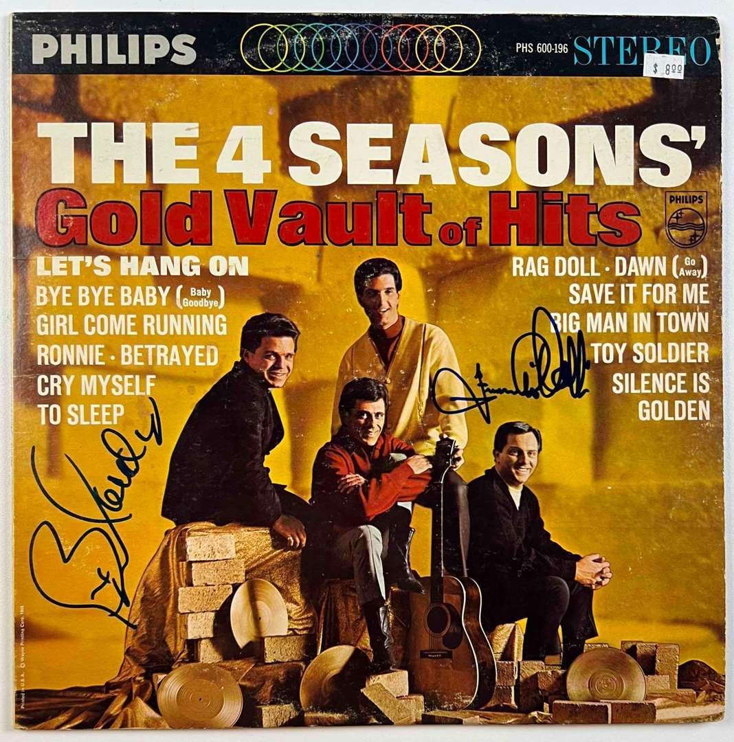 The Four Seasons Dual In-Person Signed "Gold Vault of Hits" Album (2 Sigs) (BAS Authentication): "Gold Vault of Hits" album signed on the cover in black felt tip marker by Bob Gaudio and Frankie Valli of The Four Seasons. Measuring approximately 12" x 12" and in very good condition, with some sur