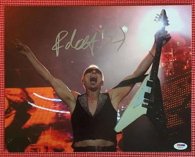 Scorpions: Rudolf Schenker Signed 8" x 10" Concert Photo with Flying V Guitar (PSA/DNA): Signed 8" x 10" color concert photograph of Scorpions guitarist Rudolf Schenker in a powerful live performance pose, holding his signature Flying V guitar aloft. Boldly signed by Schenker in silver fe
