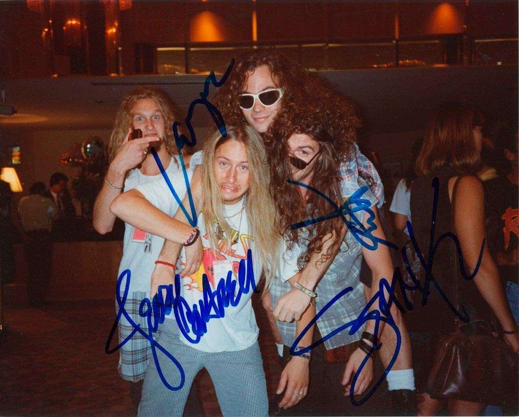 Alice in Chains Fully Group Signed 1990 Behind-the-Scenes 8" x 10" Photo (4 Sigs) (JSA): Ultra-rare 8" x 10" color photo of Alice In Chains, boldly signed in blue felt tip marker by all four original members: Layne Staley, Jerry Cantrell, Mike Starr, and Sean Kinney. This candid, playful