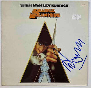 Clockwork Orange: Malcolm McDowell French Soundtrack Album (Beckett/BAS Authentication): "Orange Mecanique" French-language soundtrack album for "A Clockwork Orange", signed on the cover in blue felt tip marker by lead actor Malcolm McDowell. Measuring approximately 12" x 12" and in very