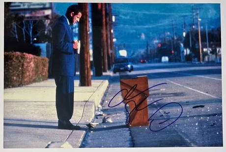 Adam Sandler In-Person Signed 8" x 12" "Punch-Drunk Love" Photo (Third Party Guaranteed): Color 8" x 12" photo from Paul Thomas Anderson&#8217;s Punch-Drunk Love, signed in blue felt tip marker by Adam Sandler with a fuller, early-career signature. In fine condition. Obtained in-person. Th