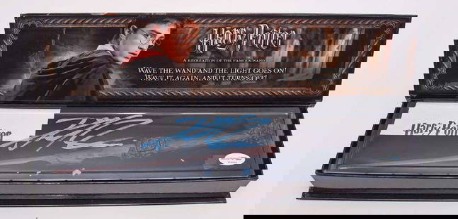 Harry Potter: Daniel Radcliffe In-Person Signed "Harry Potter Illuminating Wand" Boxed (ACOA): Harry Potter light-up replica wand signed boldly by Daniel Radcliffe in bright blue paint pen across the display window. This official Noble Collection piece comes in its original collector&#8217;s bo