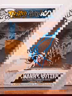 Daniel Radcliffe In-Person Signed Harry Potter #42 Funko Pop Vinyl Figure (Beckett/BAS): Officially licensed Harry Potter #42 Funko Pop boldly hand-signed by Daniel Radcliffe in striking blue paint pen across the front of the display window. The signature was obtained in person and authen
