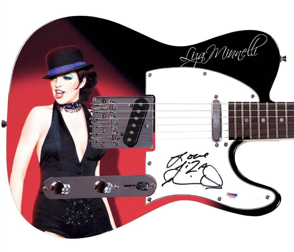 Cabaret: Liza Minelli Graphics Telecaster-Style Guitar (PSA DNA Auth.): Liza Minelli Cabaret graphics Telecaster-style electric guitar signed on the pickguard in black felt tip marker by actor and musician Liza Minelli, who inscribed her signature "Love Liza Min