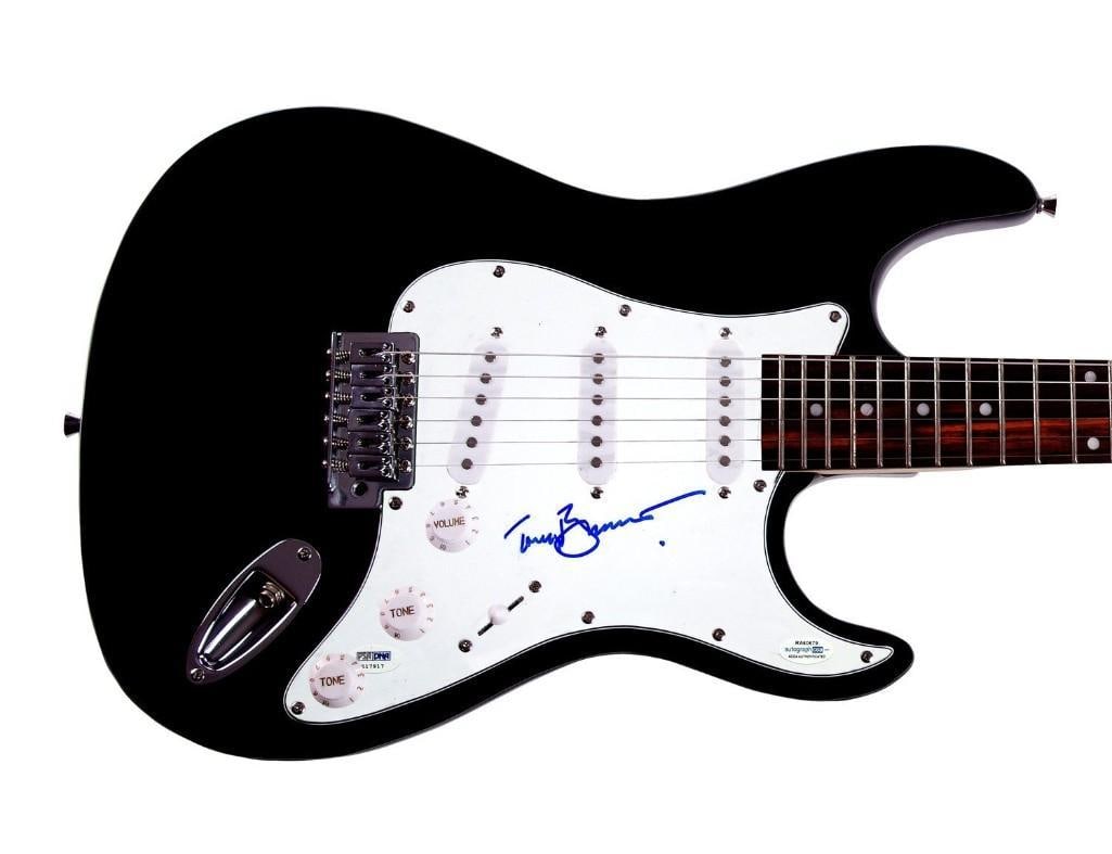Tony Bennett Signed Stratocaster-Style Guitar (PSA DNA Authentication): Stratocaster-style guitar signed on the pickguard in blue felt tip marker by musician Tony Bennett. Measuring approximately 41" x 17" x 3" and in fine condition. Authenticated by ACOA.