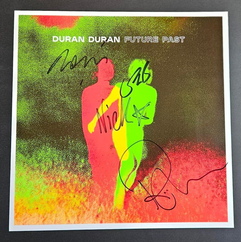 Duran Duran Group Signed 12" x 12" "Future Past" Promotional Poster (4 Sigs) (Third Party Guarantee): Color 12" x 12" "Future Past" promotional poster signed in black felt tip marker by Duran Duran bandmembers Simon LeBon, Nick Rhodes, John Taylor, and Roger Taylor. In fine condition. Obtained in