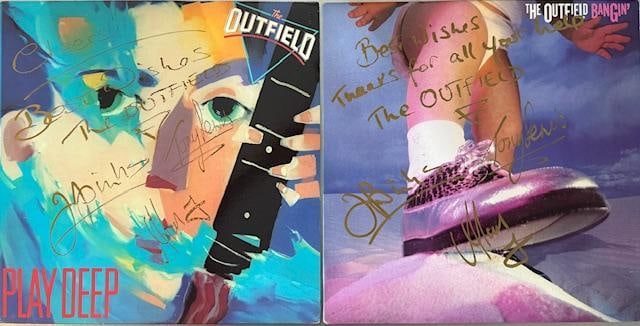 The Outfield Fully Group Signed Pair of "Play Deep" & "Bangin'" Albums (Third Party Guaranteed): Pair of two albums: "Play Deep" album signed on the cover in gold felt tip marker by The Outfield band members John Spinks, Tony Lewis, and Alan Jackman. The cover is also inscribed with the mess