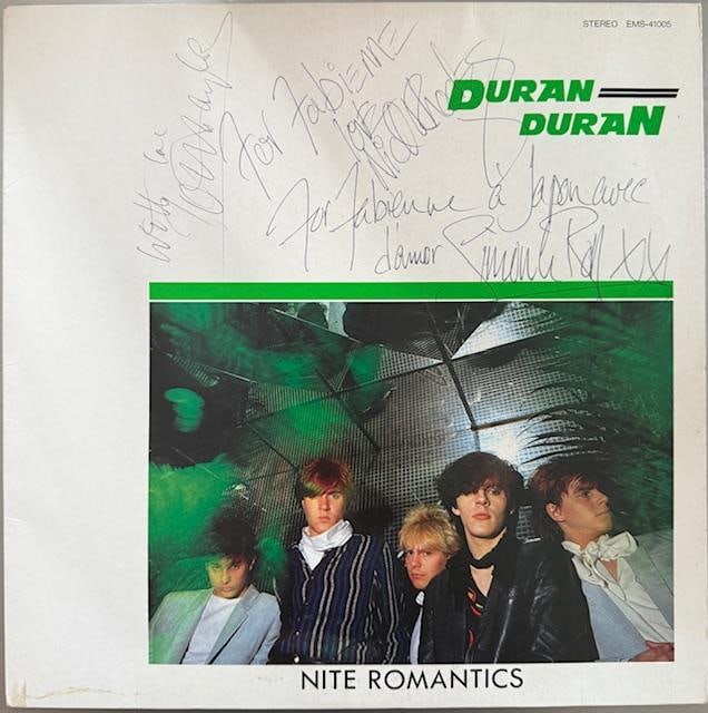 Duran Duran Group Signed Japanese "Nite Romantics" EP (3 Sigs) (Third Party Guaranteed): "Nite Romantics" Japanese EP signed on the front in blue ballpoint pen by Duran Duran bandmembers Nick Rhodes, Simon Le Bon, and John Taylor. Measuring approximately 12" x 12" and in fine conditi