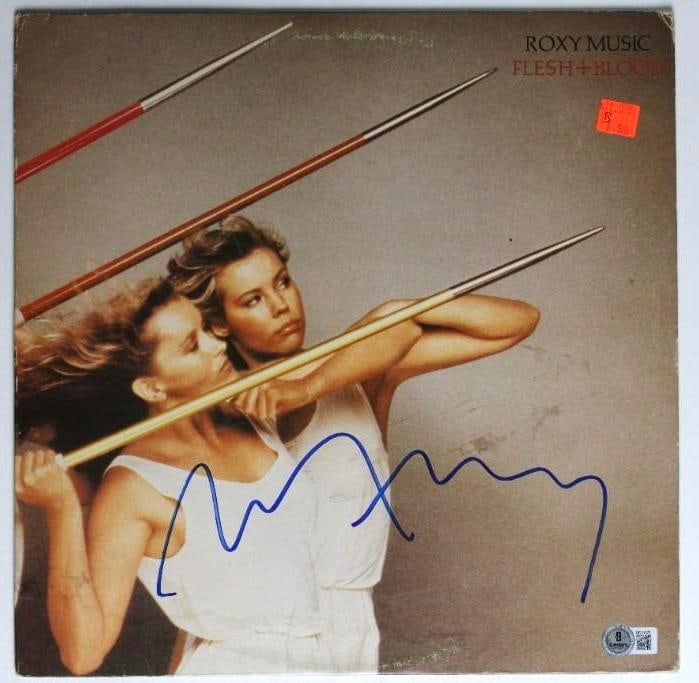 Roxy Music: Bryan Ferry Signed “Flesh + Blood” Album (2 Sigs) (Beckett/BAS Authenticatio: “Flesh + Blood” album signed on the front and back covers in blue felt tip marker by Roxy Music frontman Bryan Ferry. Measuring approximately 12” x 12” and in fine condition, o