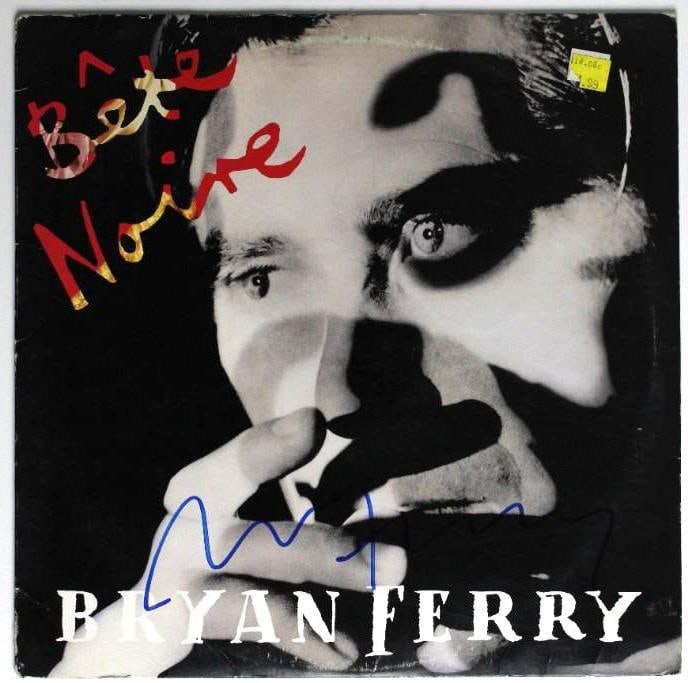 Roxy Music: Bryan Ferry Signed “Bete Noire” Album (Beckett/BAS Authentication): “Bete Noire” album signed on the cover in blue felt tip marker by musician Bryan Ferry. Measuring approximately 12” x 12” and in fine condition, obtained in-person. Record is i