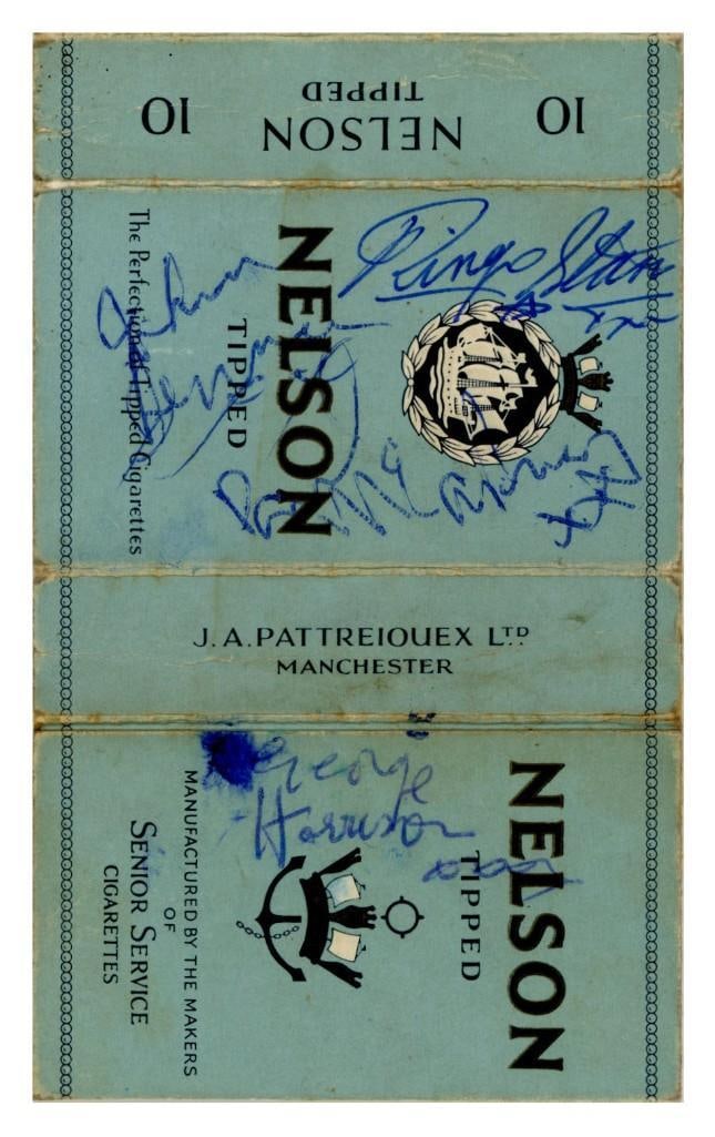 The Beatles 1962 Fully Signed Nelson Cigarette Packet with Photo (4 Sigs) (Tracks COA): Unique Nelson cigarette packet, measuring approximately 4.9" x 3", boldly signed in blue ballpoint pen by John Lennon, Paul McCartney, George Harrison, and Ringo Starr. The autographs were obtain