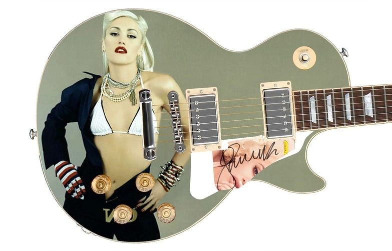 Gwen Stefani Graphics Les Paul-Style Guitar w/ Custom-Made Signed Pickguard (REAL Authentication): Gwen Stefani graphics Les Paul-style guitar signed on the custom-made pickguard in black felt tip marker by musician Gwen Steffani. Measuring 41” x 17” x 3” and in fine condition. Ac