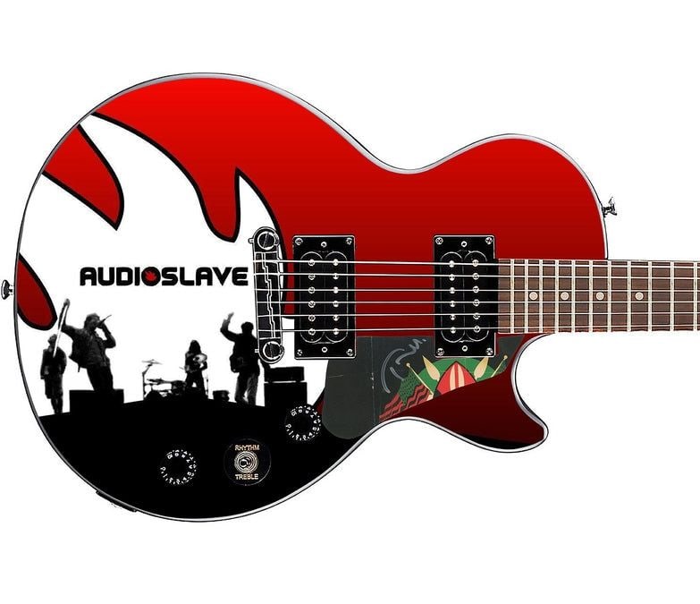 Audioslave: Tom Morello Epiphone Les Paul-Style Guitar w/ Custom-Made Signed Pickguard (REAL Auth.): Audioslave graphics Epiphone Les Paul-style guitar signed on the custom-made pickguard in silver felt tip marker by Audioslave guitarist Tom Morello. Measuring 41” x 17” x 3” and in