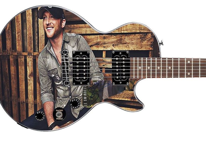 Cole Swindell Graphics Epiphone Les Paul-Style Guitar w/ Custom-Made Signed Pickguard (REAL Auth.): Cole Swindell graphics Epiphone Les Paul-style guitar signed on the custom-made pickguard in blue felt tip marker by musician Coel Swindell. Measuring 41” x 17” x 3” and in fine cond