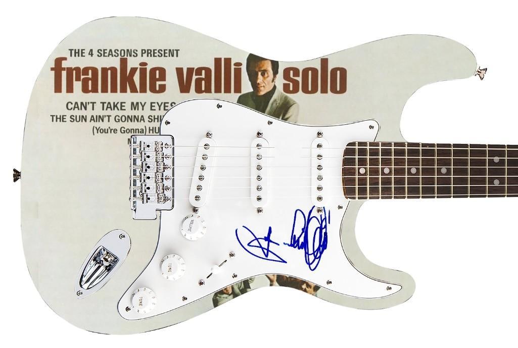 Frankie Valli Graphics Fender Stratocaster Guitar (REAL Auth.): Frankie Valli graphics Fender Squier Stratocaster guitar signed on the pickguard in blue felt tip marker by musician Frankie Valli. Measuring 39” x 13” x 1.75” and in fine condi