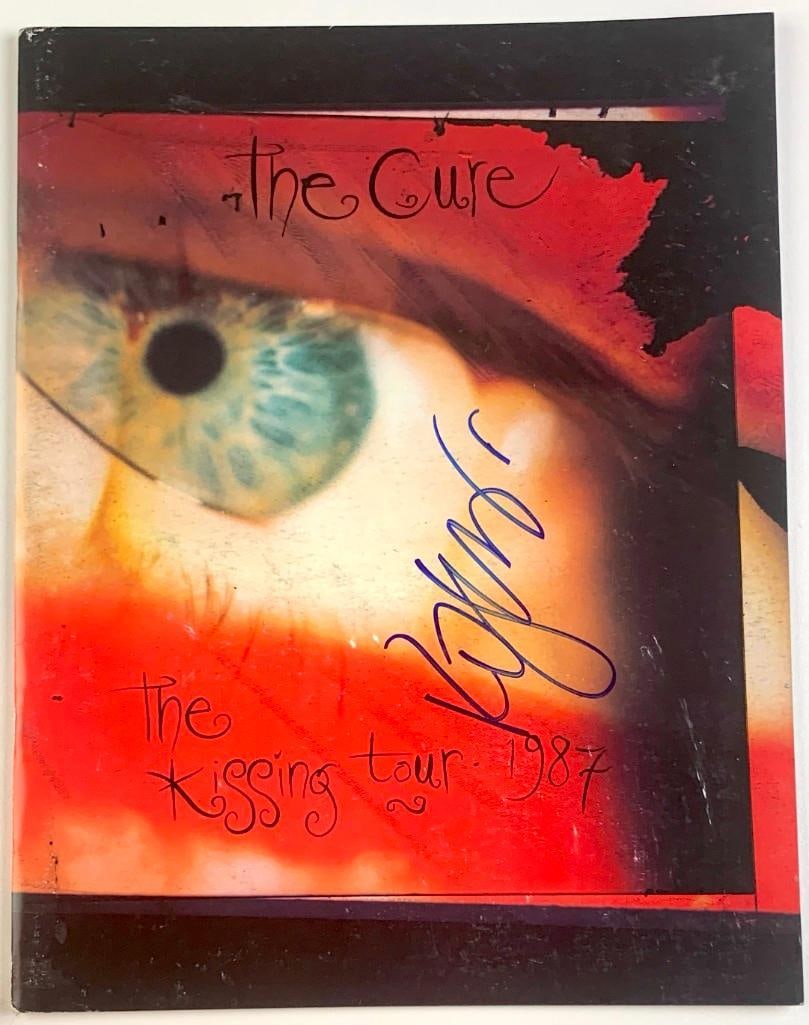The Cure: Robert Smith Signed "The Kissing Tour" 1987 Tour Program (Beckett/BAS): Color The Kissing Tour" 1987 program, signed in blue felt tip marker by The Cure frontman Robert Smith. In fine condition. Authenticated by Beckett/BAS, with their official hologram affixed to the bac