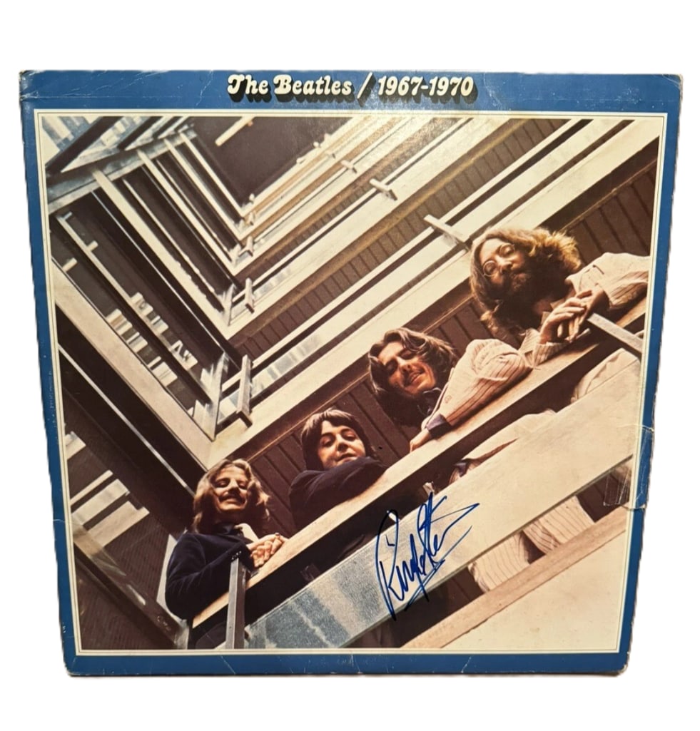 The Beatles: Ringo Starr Signed "The Beatles 1967-1970" Album (Beckett/BAS Authentication): "The Beatles 1967-1970" signed on the cover in blue felt tip marker by The Beatles drummer Ringo Starr, who signed his full name. Measuring approximately 12" x 12" and in very good condition, with som