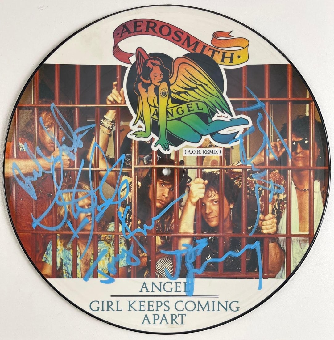 Aerosmith Fully Group Signed "Angel" Album Picture Vinyl Disc (5 Sigs) (Beckett/BAS): "Angel" picture vinyl disc signed on Side B in blue paint pen by all five Aerosmith bandmembers Steven Tyler, Tom Hamilton, Joey Kramer, Joe Perry and Brad Whitford. Measuring