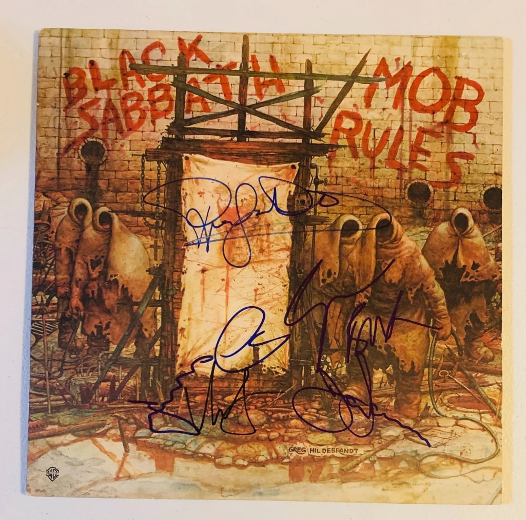 Black Sabbath Group Signed "Mob Rules" Album (4 Sigs) (Beckett/BAS Authentication): "Mob Rules" album signed on the front and back covers in black felt tip marker by Black Sabbath band members Ronnie James Dio, Tony Iommi (signed twice), Geezer Butler, and Vinny Appice. Measuring app