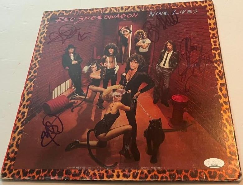REO Speed Wagon Group Signed "Nine Lives" LP Album (4 Sigs) (JSA Authentication): "Nine Lives" LP album signed on the cover in black felt tip marker by REO Speed Wagon band members Kevin Cronin, Bruce Hall, Alan Gratzer, and Neal Doughty. Measuring approximately 12" x 12" and in fi