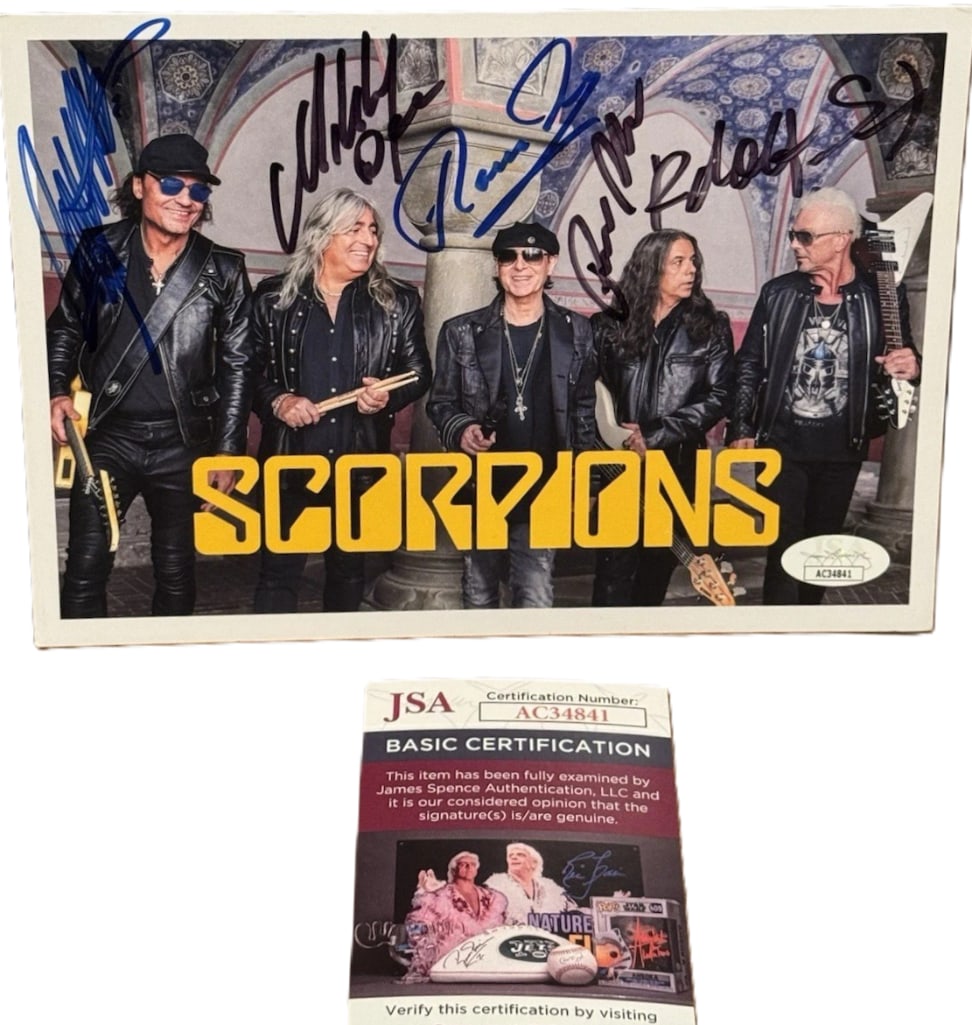 Scorpions Fully Group Signed 8" x 10" Photo (5 Sigs) (JSA Authentication): Color 8" x 10" photo signed in blue and black felt tip markers by Scorpions band members Rudolf Schenker, Klaus Meine, Matthias Jabs, Francis Buchholz, and Herman Rarebell. In fine condition.