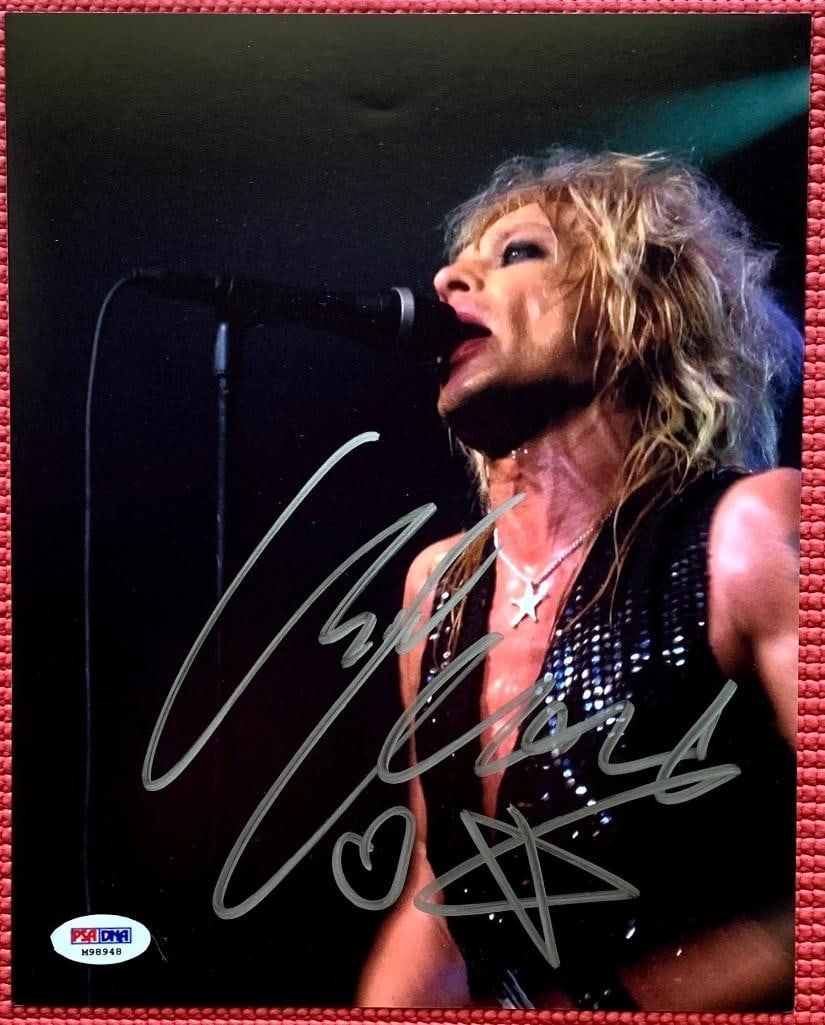 Hanoi Rocks: Michael Monroe Signed 10" x 8" Photo (PSA DNA Authentication): Color 10" x 8" photo signed in silver felt tip marker by Hanoi Rocks front man Michael Monroe, who also inscribed a heart and star below his signature. In fine condition. Accompanied by a PSA DNA