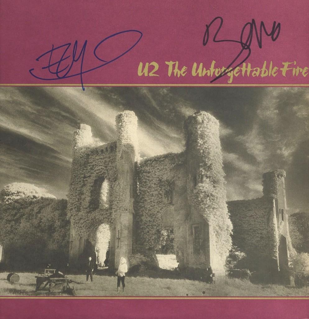 Bono & The Edge Signed "U2 The Unforgettable Fire" Album (2 Sigs) (ACOA Authentication): "U2 The Unforgettable Fire" album signed on the cover in blue and black felt tip markers by musicians Bono and The Edge. Measuring approximately 12" x 12" and in fine condition. Obtained in-person. Ac