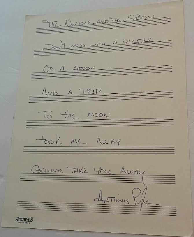 Lynyrd Skynyrd: Artimus Pyle Signed Hand-Written "Needle and the Spoon" Lyric Sheet (TPG): White lined paper with lyrics to "Needle and the Spoon" hand-written and signed in blue ballpoint pen by Lynyrd Skynyrd band member Artimus Pyle. In fine condition.ProvenanceEaton & Brennan Auctions