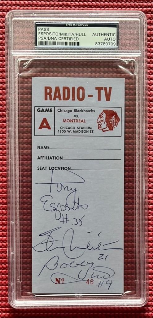 Bobby Hull, Stan Mikita, & Tony Esposito Signed 6.75" x 3" Blackhawks Press Pass (3 Sigs) (PSA): Color slabbed 6.75" x 3" Chicago Blackhawks press pass signed on the front in black ballpoint pen by hockey players Bobby Hull, Stan Mikita, and Tony Esposito. Each player included their jersey