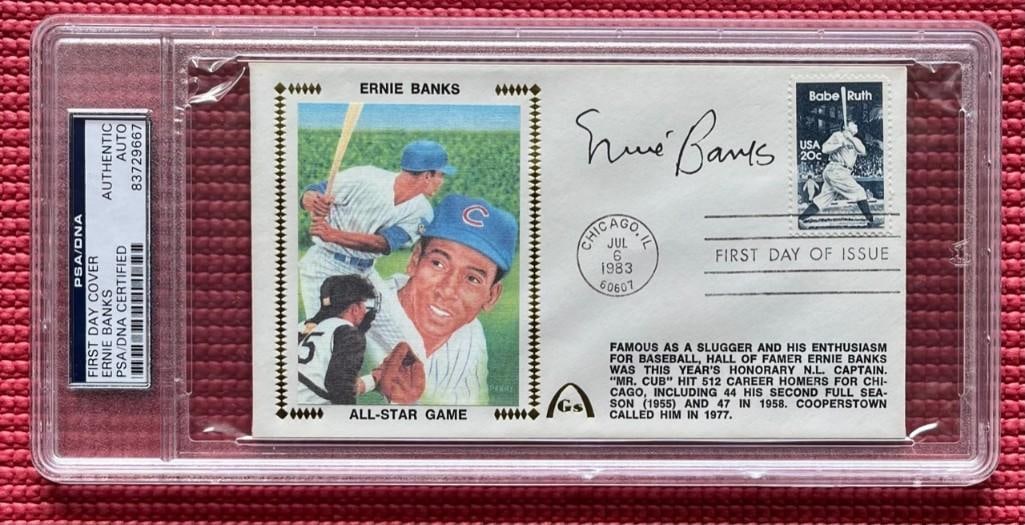 Ernie Banks Signed 3" x 6" First Day of Issue Envelope (PSA DNA Authentication): Color 3" x 6" first day of issue envelope signed on the front in black ballpoint pen by baseball player Ernie Banks. In fine condition. Encapsulated and authenticated by PSA DNA (#83729667).