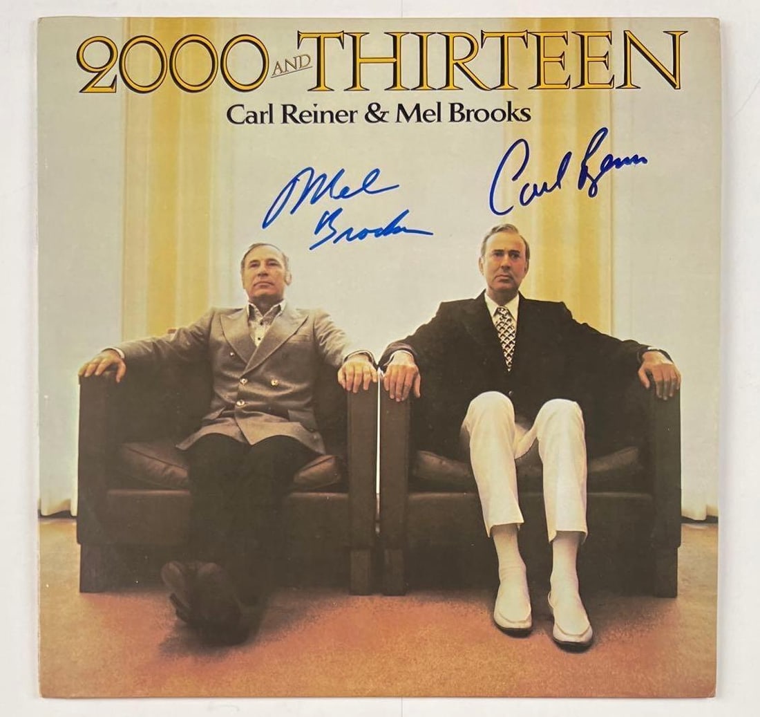 Mel Brooks & Carl Reiner Signed "2000 and Thirteen" Album (2 Sigs) (JSA Authentication): "2000 and Thirteen" album signed on the cover in blue felt tip marker by directors, actors, and producers, Mel Brooks and Carl Reiner. Measuring approximately 12" x 12" and in fine condition. Record