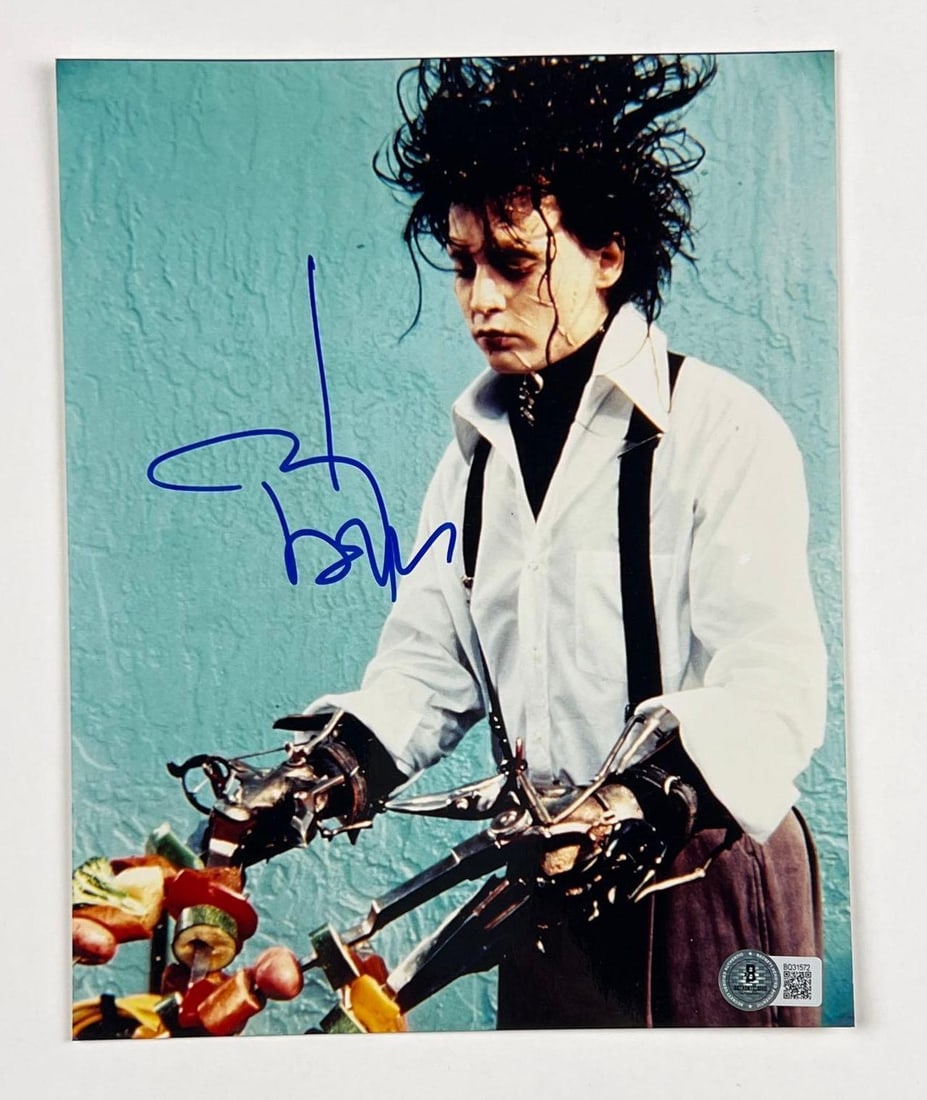 Johnny Depp Signed 10" x 8" "Edward Scissorhands" Photo (Beckett/BAS Authentication): Color 10" x 8" photo of the character Edward Scissorhands doing his classic pose from the film "Edward Scissorhands" signed in blue felt tip marker by actor Johnny Depp. In fine condition.