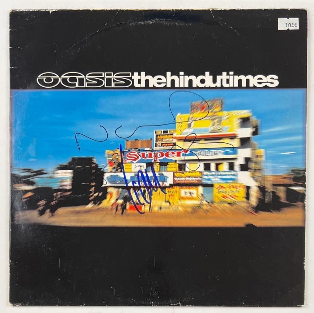 Oasis: Liam & Noel Gallagher Signed "The Hindu Times" Album (2 Sigs) (Beckett/BAS Authentication) (1 of 3)