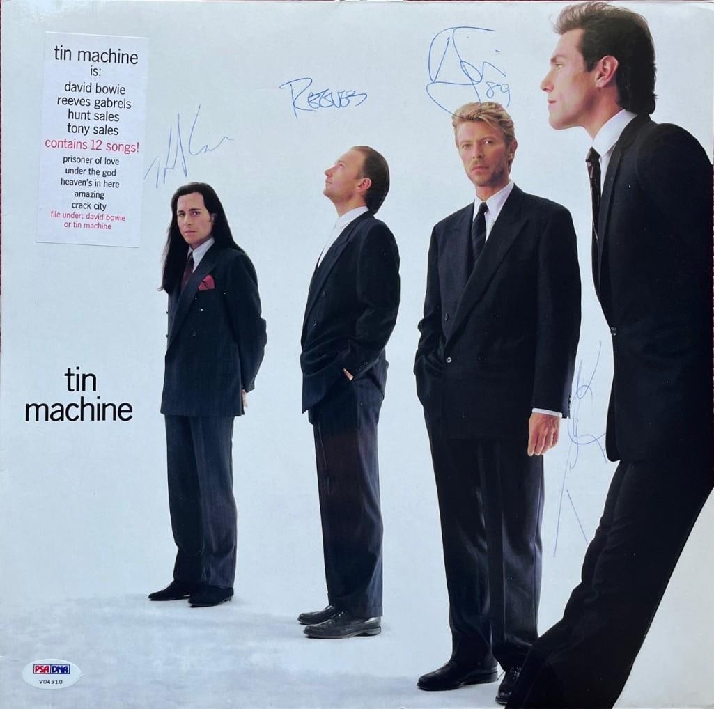 David Bowie: Tin Machine Group Signed "Tin Machine" Debut Album (4 Sigs) (PSA DNA Authentication): "Tin Machine" album signed on the cover in blue ballpoint pen by Tin Machine band members David Bowie, Tony Sales, Hunt Sales, and Reeves Gabrels. Bowie additionally inscribed the date "89" after his