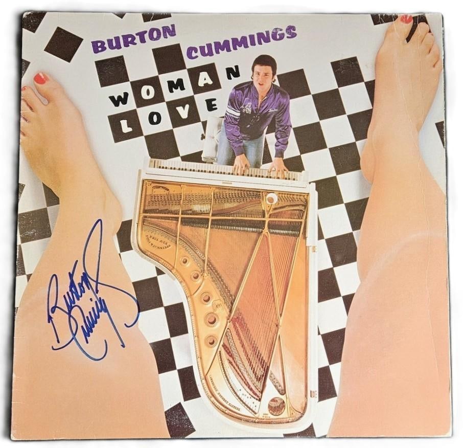 The Guess Who: Burton Cummings Signed “Woman Love” Album (Third Party Guaranteed): “Woman Love” album signed on the cover in blue felt tip marker by Guess Who bandmember Burton Cummings. Measuring approximately 12” x 12” and in fine condition. Record is inclu
